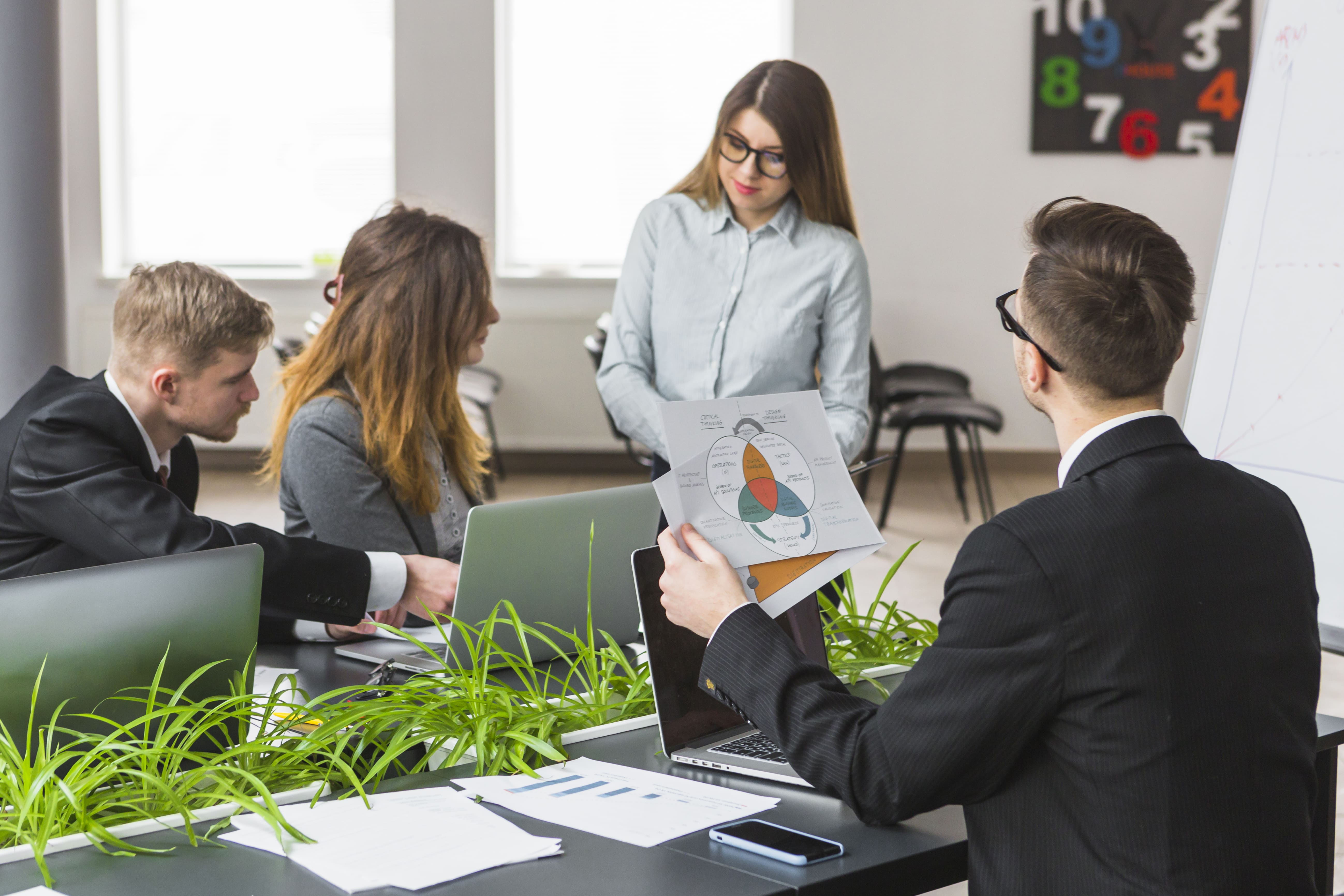 Genz Talent group businesspeople analyzing graph workplace 2